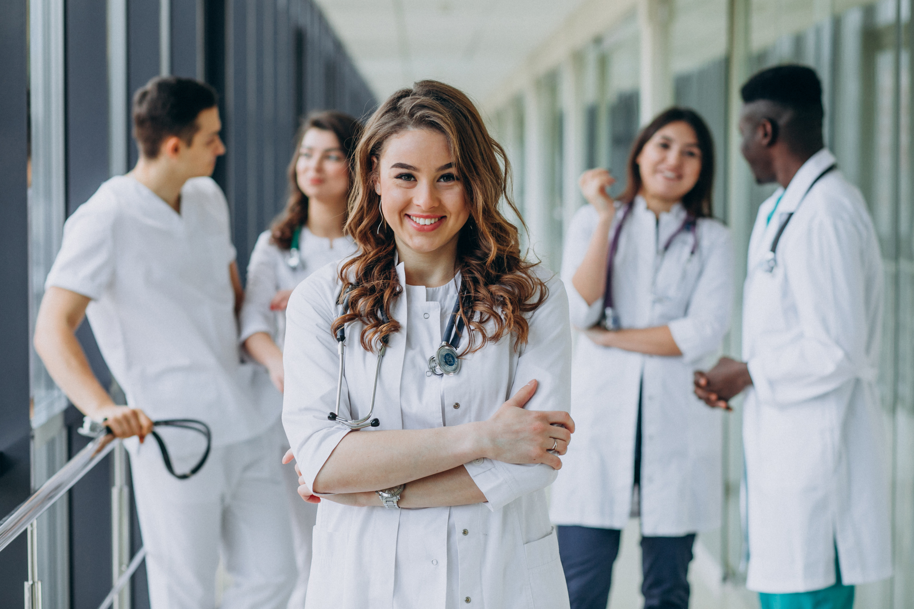 Confident nurse in a modern hospital, ready to advance her career
